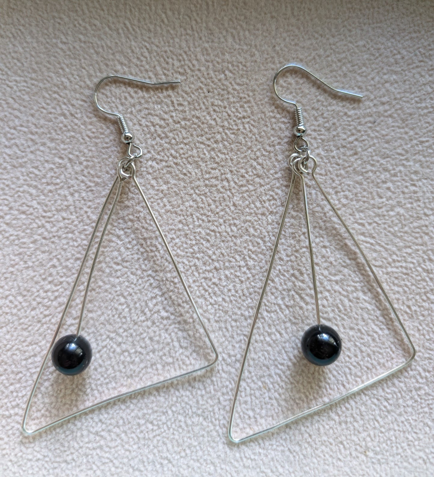 Triangle drop earrings with silver colored wire